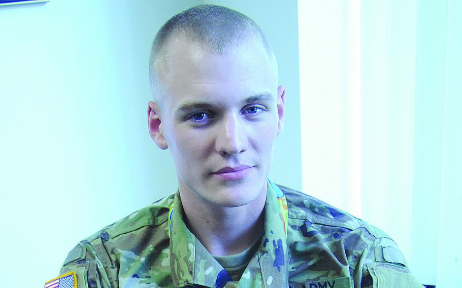 Pole-vaulter Sam Kendricks, then a second lieutenant in the U.S. Army Reserve, poses with the bronze medal he earned at the Rio Olympics in 2016.  