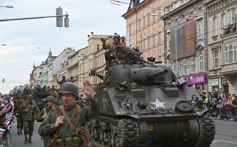 American military vehicles from World War II, accompanied by reenactors, parade down the main boulevard in Pilsen, Czech Republic, during the city's Liberation Festival on Sunday, May 5, 2024. 