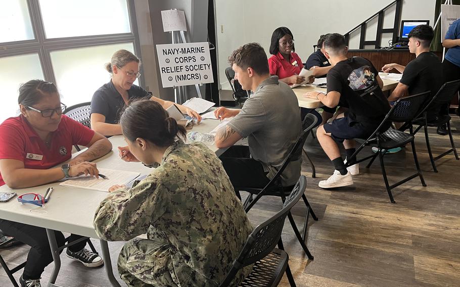 In the wake of Typhoon Mawar, people apply for emergency aid from the Navy-Marine Corps Relief Society on Guam, June 2, 2023.