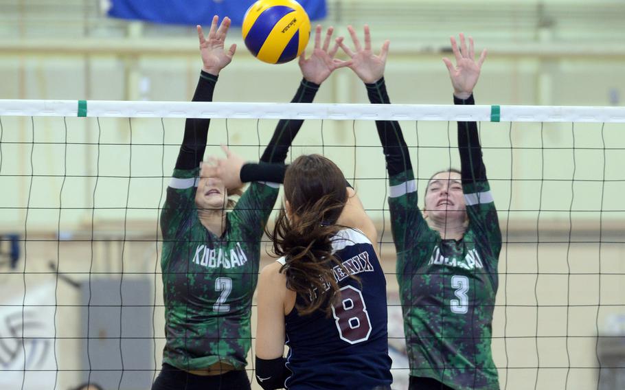 Seisen International's Lisa Purcell spikes against Kubasaki's Grace Berrens and Adria Lockhart during Friday's pool-play match in the Ryukyu Island Girls Volleyball Tournament. The Dragons swept both sets in a rematch of last Saturday's final in the American School In Japan YUJO Tournament.