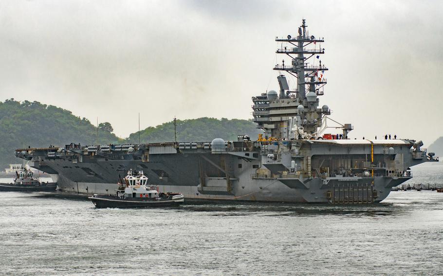 The aircraft carrier USS Ronald Reagan heads out on patrol from Yokosuka Naval Base, Japan, Tuesday, May 23, 2023.