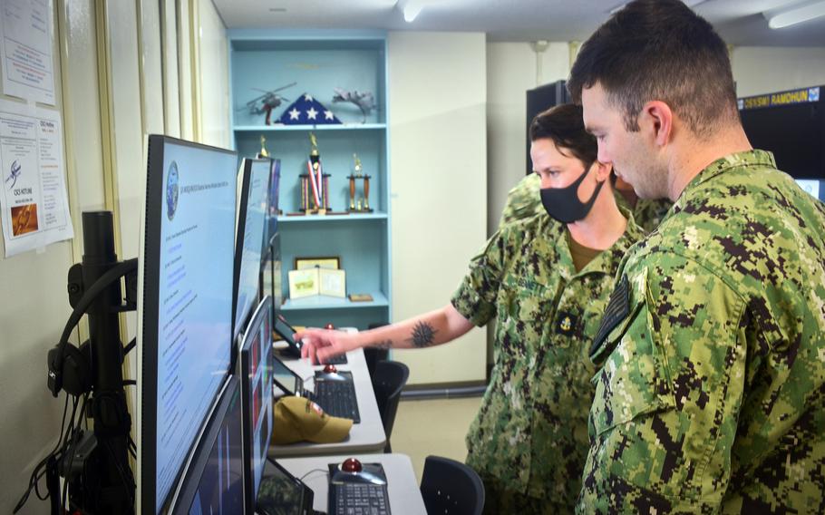 Sailors check out the new anti-submarine warfare training simulator at Yokosuka Naval Base, Japan, Friday, Oct. 15, 2021. 