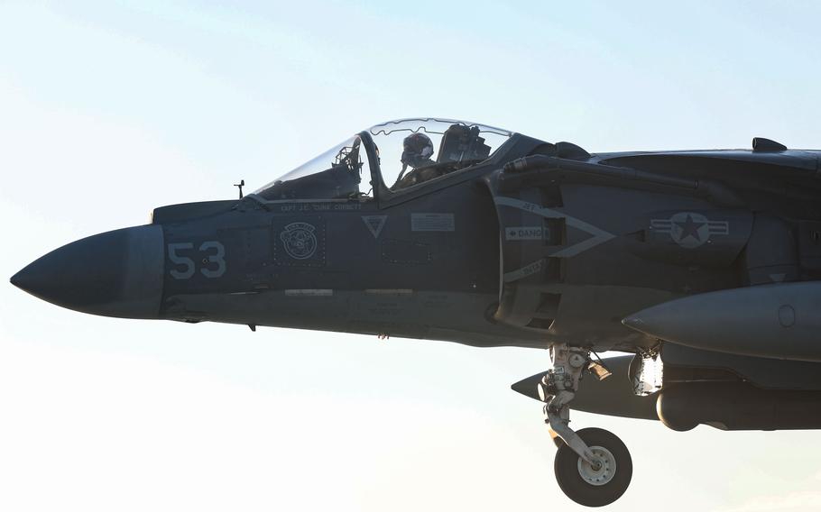 A closeup of the pilot’s seat of a fighter jet in the air.