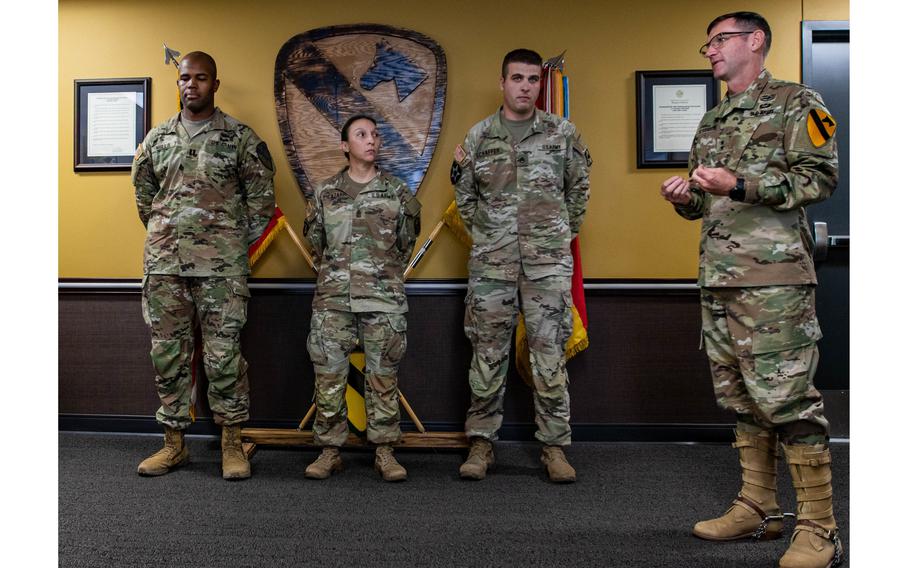 Maj. Gen. John B. Richardson, right, 1st Cavalry Division commanding general, recognizes three soldiers for their ability to take action as a leader and save the life of a Trooper at Fort Hood, Texas, July 11. The soldiers are, from left: Cpt. Aaron Mills, commander, Headquarters and Headquarters Troop, 4th Squadron, 9th Cavalry Regiment; Sgt. Maj. Rocio Picazarri, 1st Medical Brigade operations sergeant major; and Staff Sgt. Justin Schaffer, 1st Medical Brigade schools non-commissioned officer.