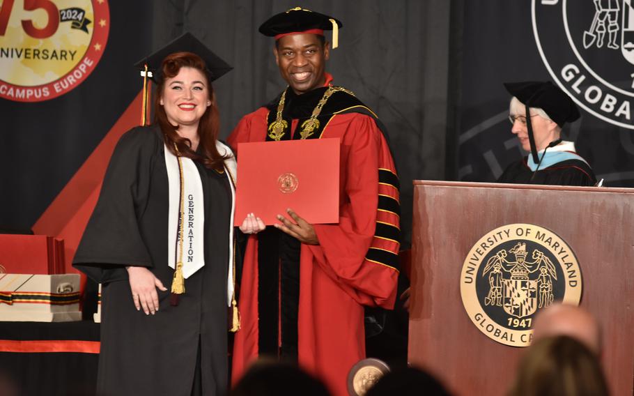 Air Force Tech. Sgt. Vanessa Alonzo receives her bachelor’s degree in criminal justice from Gregory Fowler, the president of University of Maryland Global Campus, at commencement on Saturday. About 250 graduates walked the stage on Saturday, April 27, 2024, inside the Ramstein Officers’ Club at Ramstein Air Base, Germany.