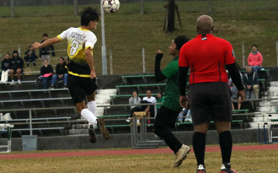 Kadena's Tuck Renquist heads the ball in front of Kubasaki's Ayden Rodrigues during Wednesday's Okinawa boys soccer match. The Panthers won 3-2.