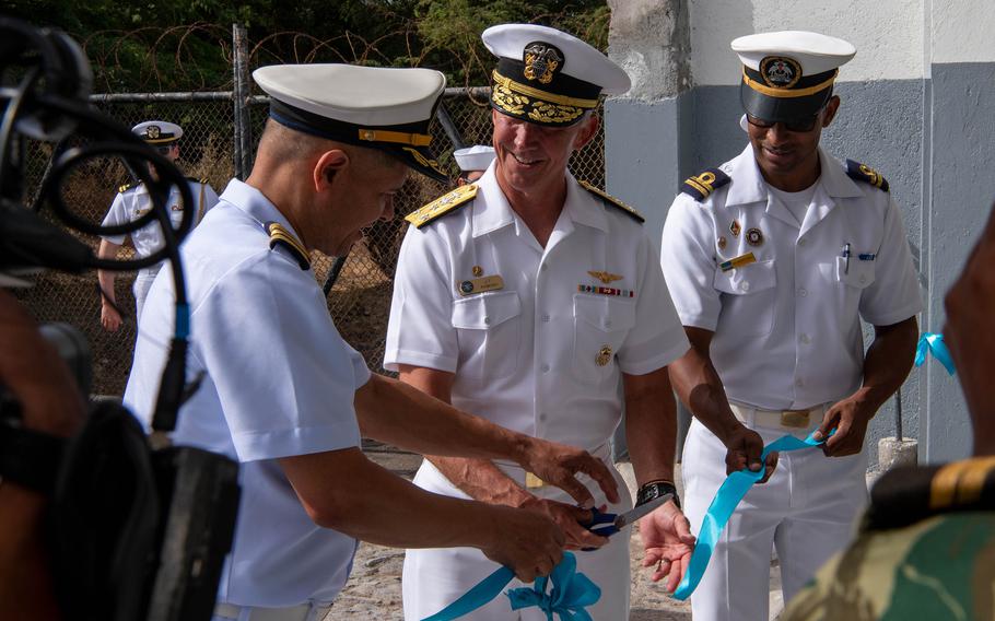 Anderson with two other officers cuts the ribbon.