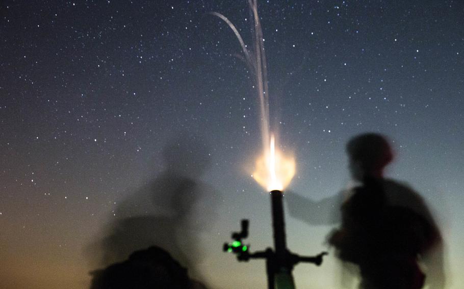 Members of the 11th Marine Expeditionary Unit fire mortors during training at Camp Buehring, Kuwait, July 28, 2019. 