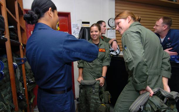 Hed: Not your average summer cruise, 2009

Naval Air Facility Atsugi, Japan, June 2, 2009: A sailor from Helicopter Anti-Submarine Squadron Light 51 helps midshipmen Monica Cooney, right, and Christi Morrissey get into their flight gear before a training flight at Naval Air Facility Atsugi. The two women are in Japan as part of a four-week summer training cruise. The two Navy Reserve Officers’ Training Corps candidates are from University of Michigan and Harvard, respectively.

Read about the NROTC's Summer Training Cruise here.
https://www.stripes.com/news/2009-06-06/midshipmen-make-most-of-summer-cruise-1944357.html1

META TAGS: U.S. Naval Academy, Naval Reserve Officers' Training Corps; NROTC; U.S. Navy; 