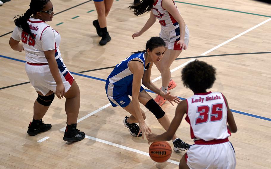 Marymount’s Giselle AlHamarneh tries to past through Aviano’s Alayna Williams, left, and Lanaia Burkes during pool play of the Division II DODEA European Basketball Championships on Wednesday at Southside Fitness Center on Ramstein Air Base, Germany.