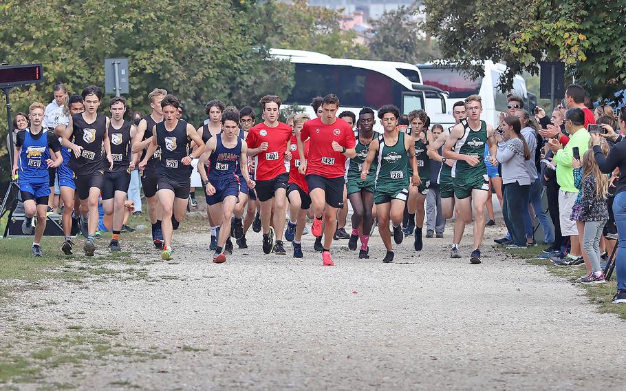 Runners start off the boys race at Lago di Fimon, Italy, during the DODEA South cross country championships on Saturday, Oct. 23, 2021.