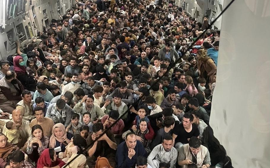 A U.S. Air Force C-17 Globemaster III transports over 820 Afghan citizens from Kabul's Hamid Karzai International Airport in Afghanistan, Aug. 15, 2021. The original count released by the Air Force didn't include 183 children.