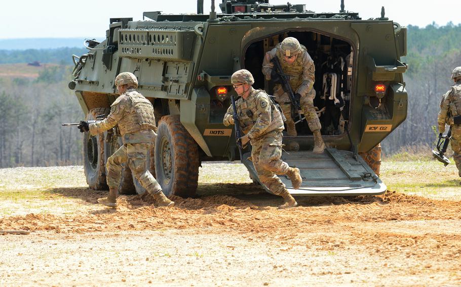 U.S. soldiers with Fort Benning’s 316th Cavalry Brigade exit a Stryker during a live-fire demonstration March 24, 2022, at the Georgia installation for top African military leaders during the U.S. Army’s African Land Forces Summit. 