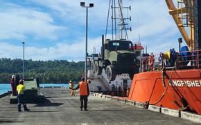 A medium tactical vehicle deployed with Naval Mobile Construction Battalion 5 arrives at Lombrum Naval Base, Papua New Guinea, in September 2021.