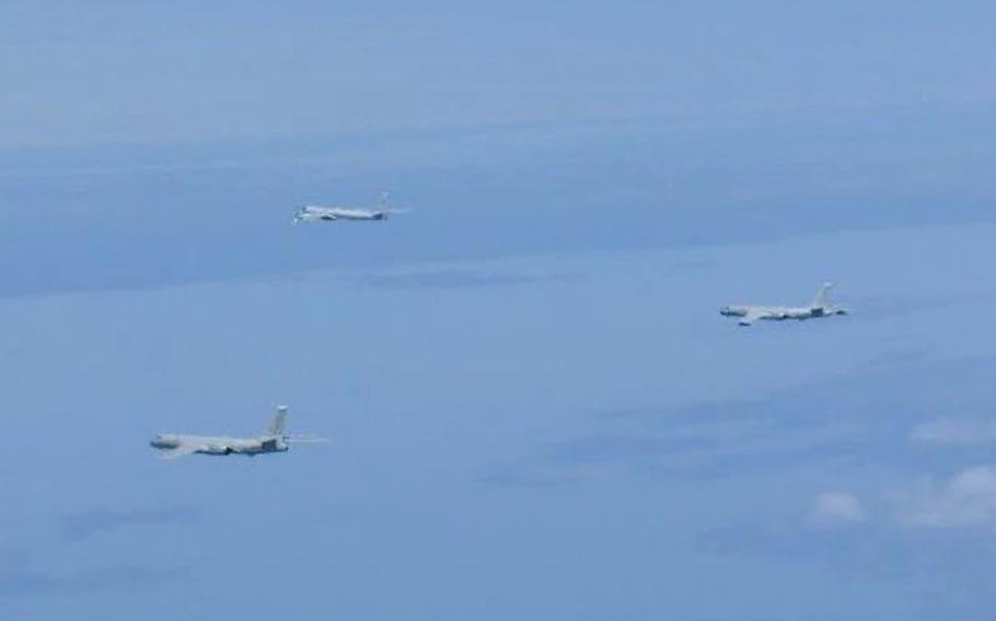 A Russian TU-95 bomber flies with Chinese H-6 bombers over the East China Sea, Tuesday, May 24, 2022. 
