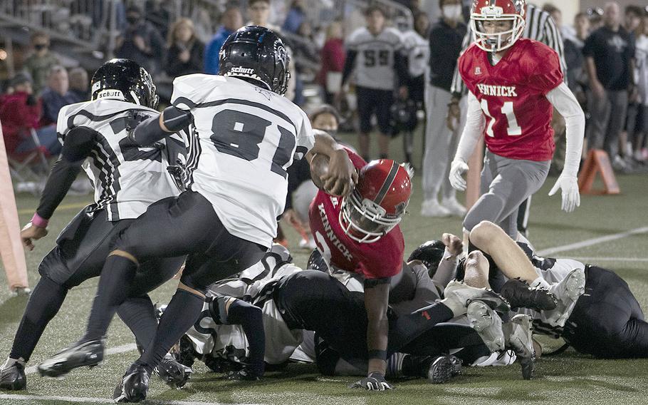 Kinnick's Wendell Harrison lunges through Zama defenderes for the end zone.