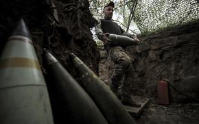 FILE - In this photo provided by Ukraine's 24th Mechanized Brigade press service, a serviceman prepares to fire a howitzer toward Russian army positions near Chasiv Yar, Donetsk region, Ukraine, June 14, 2025. (Oleg Petrasiuk/Ukraine's 24th Mechanized Brigade via AP, File)