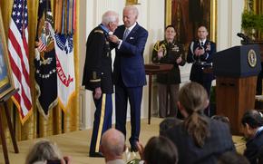 President Joe Biden awards the Medal of Honor to retired Maj. John Duffy for his actions on April 14-15 1972, during the Vietnam War, during a ceremony in the East Room of the White House, Tuesday, July 5, 2022, in Washington. 