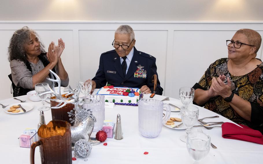 Retired U.S. Air Force Brig. Gen. Charles McGee, documented Tuskegee Airman, is presented with a birthday cake in celebration of his 102nd birthday Dec. 6, 2021, at Joint Base San Antonio-Randolph, Texas.