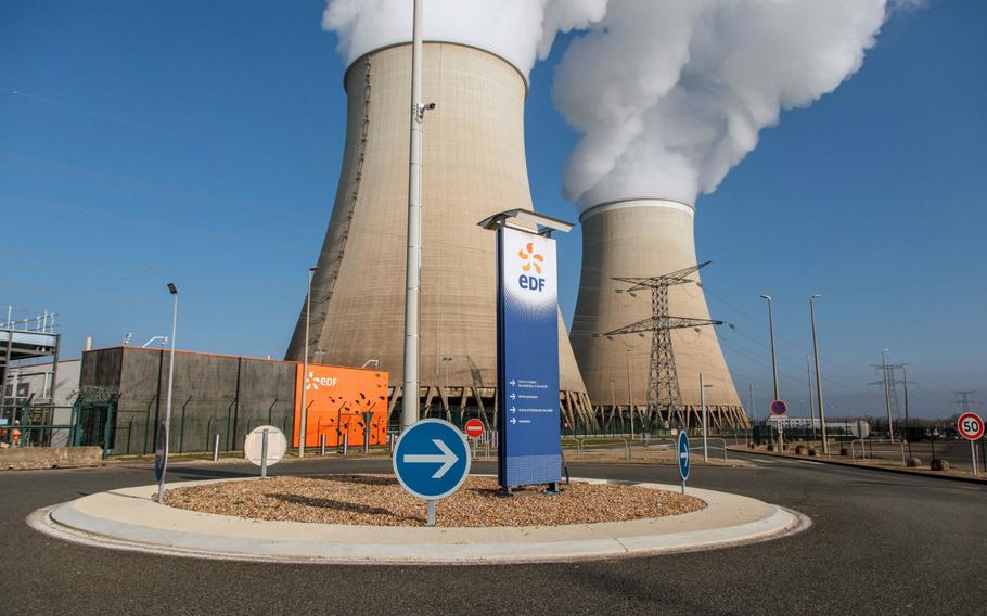 Cooling towers release water vapor at the Nogent nuclear power plant in Nogent-sur-Seine, France, on Dec. 21, 2021. 