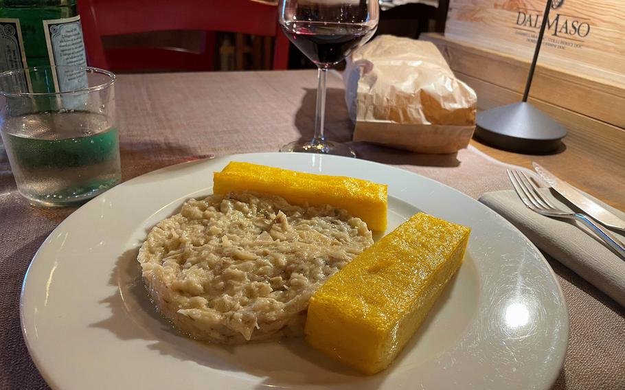 Osteria Monelli in downtown Vicenza offers a tasty menu of local specialties, like this cod dish served with a side of fried polenta. 