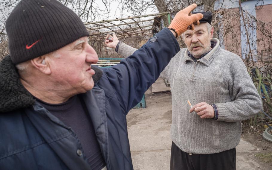Yuriy Boronko, 69, left, and Valeriy Kulysh, 57, walk in Mylove.