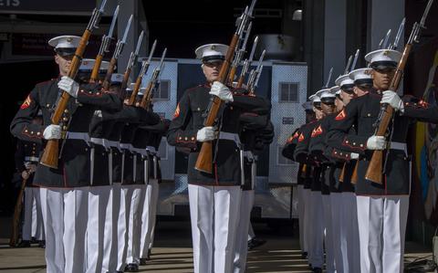 Marines from Marine Barracks Washington stand at attention before performing at a Washington Commanders game in November 2023.