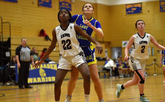 AFNORTH freshman Makayla McNiell-Mark boxes out Sigonella forward Anabel Vaiciulis during a Division III semifinal at the DODEA European Basketball Championships on Feb. 16, 2024, at Wiesbaden High School in Wiesbaden, Germany.
