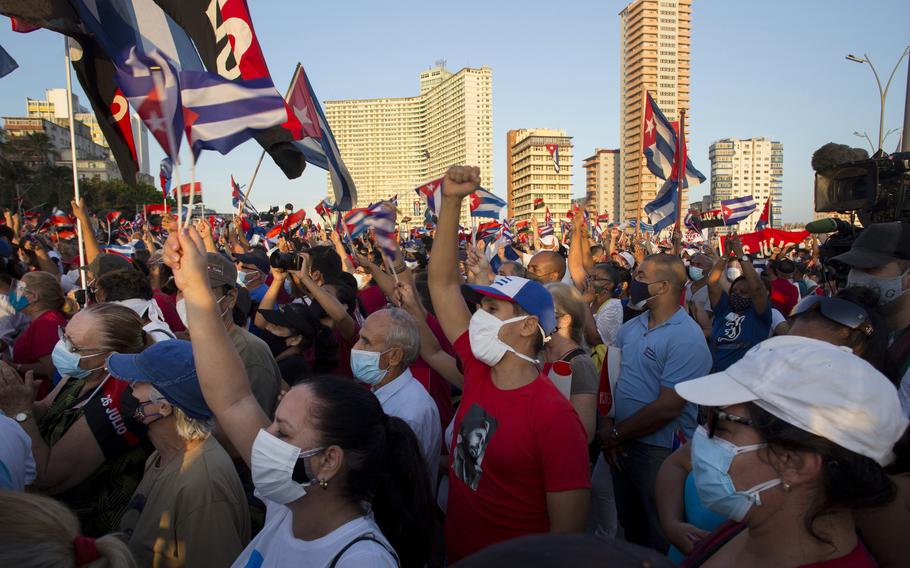 People attend a cultural-political event on the seaside Malecon Avenue with thousands of people in a show of support for the Cuban revolution six days after the uprising of anti-government protesters across the island, in Havana, Cuba, Saturday.