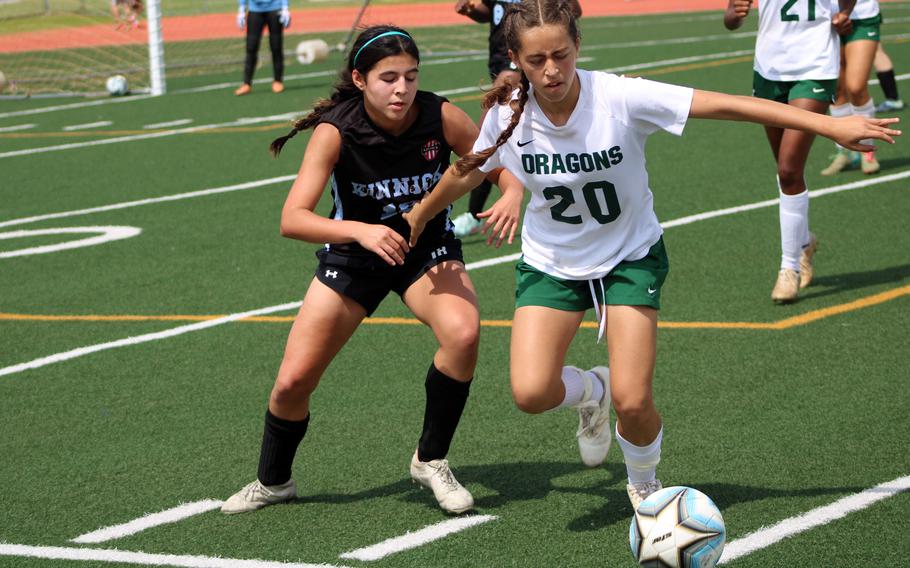Kinnick's Julia Blackwell and Kubasaki's Victoria Facchini battle for the ball.