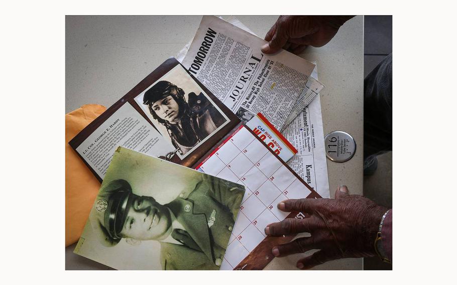 Air Force veteran Leonard Hopkins, 90, shares a photo of himself, and his cousin, a fellow Tuskegee airman pictured on a calendar, as Black military veterans gathered daily to share memories, stories, and fellowship at a local McDonald’s on March 28, 2024 in Miami, Florida.