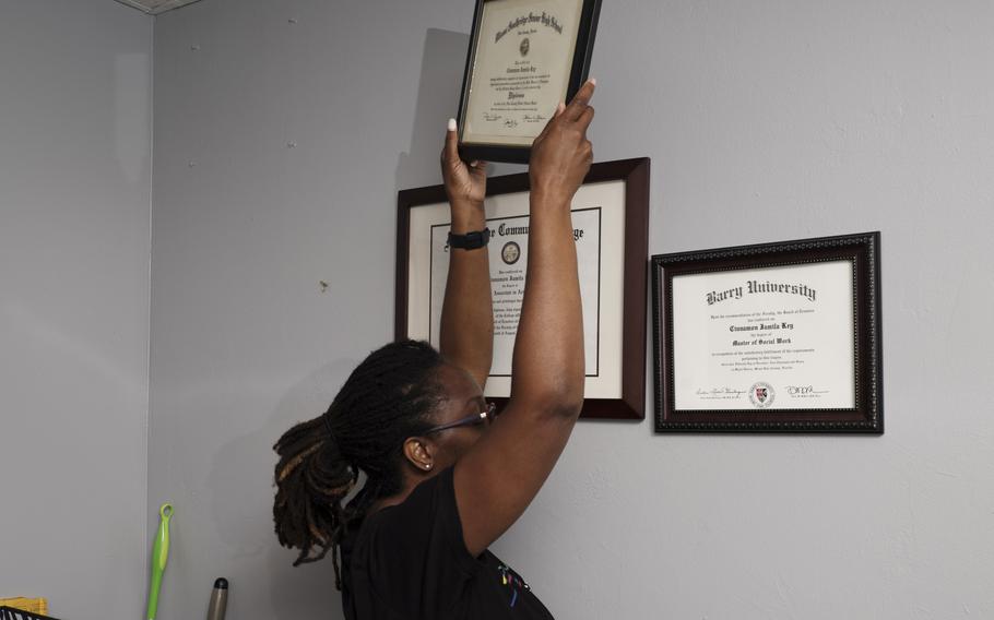 Natalie Rowe packs up Cinnamon Key's diplomas from her office in Miami on May 28, 2021.