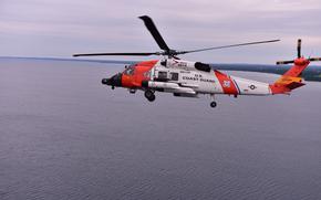 A Coast Guard Air Station Traverse City MH-60 helicopter practices formation flying over Grand Traverse Bay, June 28, 2024.
Air Station Traverse City flew with Air Station Detroit as part of the National Cherry Festival Airshow.