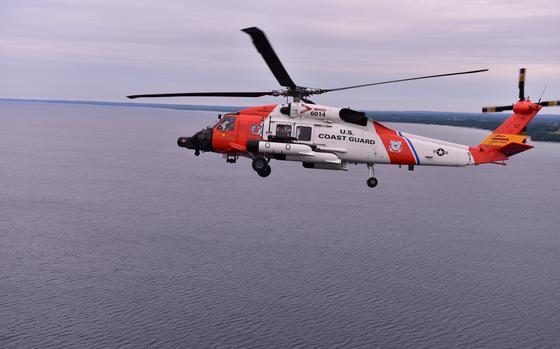 A Coast Guard Air Station Traverse City MH-60 helicopter practices formation flying over Grand Traverse Bay, June 28, 2024.
Air Station Traverse City flew with Air Station Detroit as part of the National Cherry Festival Airshow.