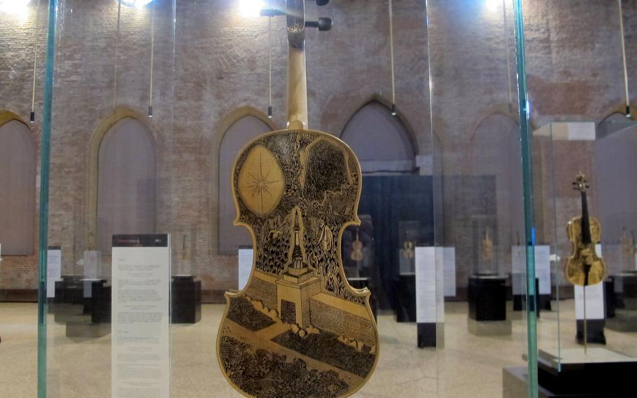 Vicenza-born artist Leonardo Frigo painted 33 violins and one cello with scenes from Dante's epic poem the "Divine Comedy" for the first exhibition at the Palladian Basilica since the pandemic-forced lockdown more than a year ago. The exhibit runs through Aug. 31.