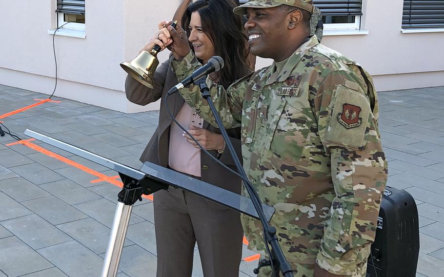 Michelle Howard-Brahaney, director of Department of Defense Education Activity-Europe, and Brig. Gen. Otis Jones, 86th Airlift Wing commander, ring a bell to usher in the first day of school on Aug. 22, 2022, at Kaiserslautern Elementary School in Germany. Most DODEA students at military schools overseas went back to school Monday.