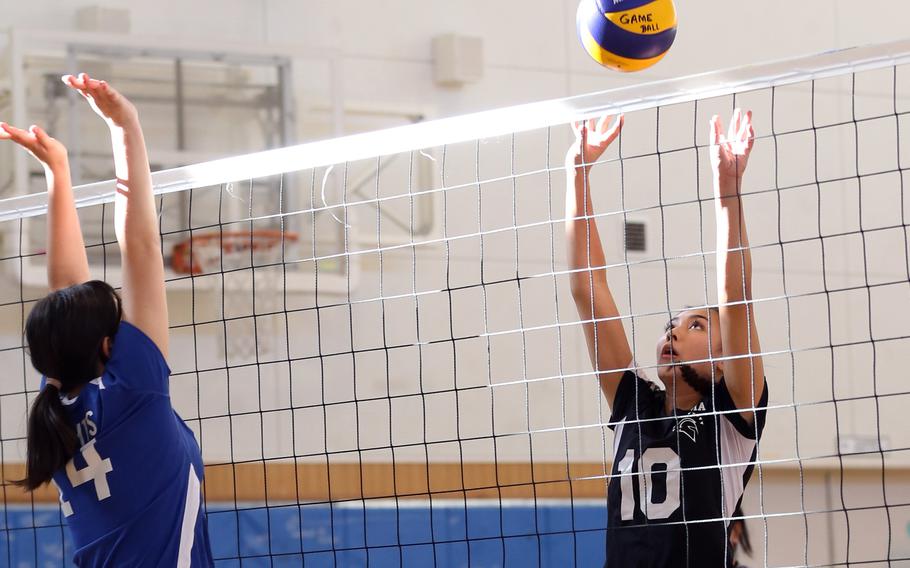 Zama's Emma Sakamoto-Flack goes up for the ball at the net against Christian Academy Japan's Anna Liljesson.