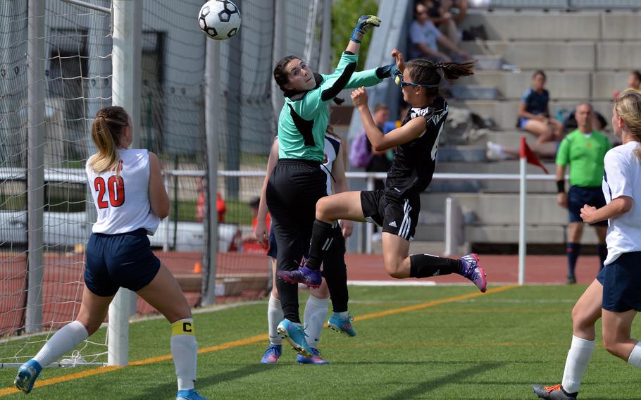 Vicenza’s Julia Rudy goes against Aviano keeper Grace Gonzales in the girls Division II final at the DODEA-Europe soccer championships in Kaiserslautern, Germany, Thursday, May 19 2022. The ball bounced around the goal line and against bodies before landing in the net for a goal. Vicenza defeated Aviano 2-0 to take the title.