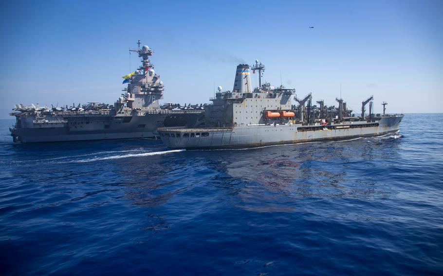 Aircraft carrier USS Gerald R. Ford steams alongside USNS Laramie during a fueling-at-sea in the eastern Mediterranean Sea on Oct. 11, 2023. 