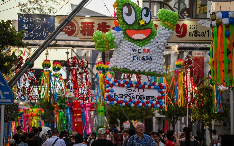 The Fussa city mascot made from balloons hangs over the city’s main street.