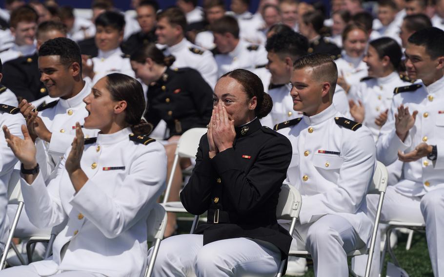 Naval Academy graduates during their May 26, 2023, commissioning ceremony in Annapolis, Md. Midshipman Caitlin Doran, center, was headed for assignment as a second lieutenant in the Marine Corps.