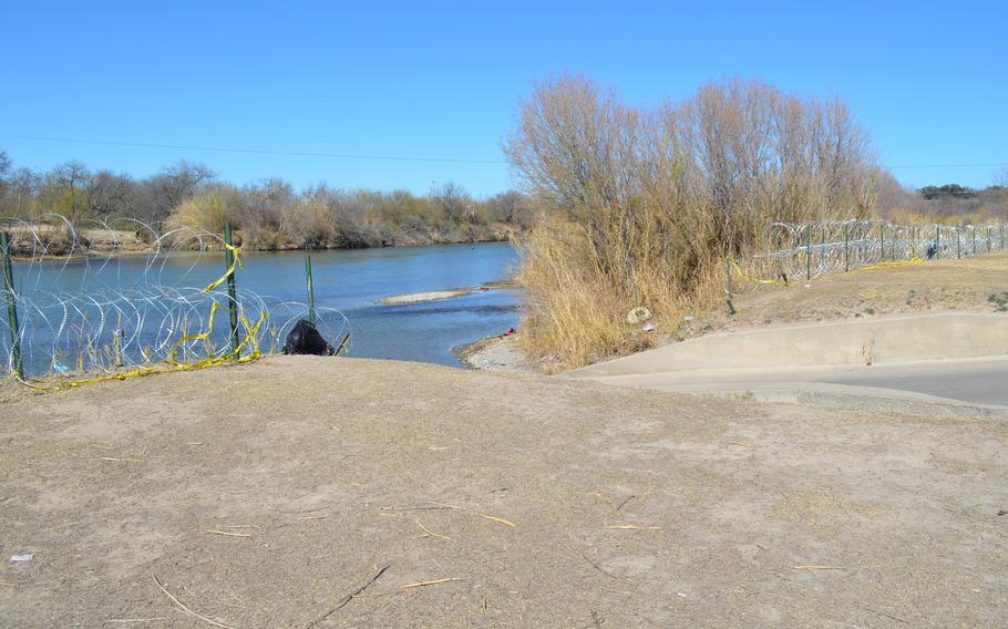 The Rio Grande is seen from Eagle Pass, Texas, in February 2022. The Texas National Guard has placed coiled barbed wire along the border to deter people from crossing illegally into the U.S. from Mexico. 