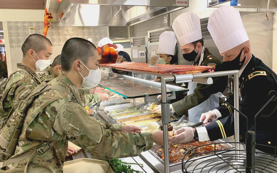 U.S. Forces Korea senior leaders serve Thanksgiving meals for Korean Augmentation to the U.S. Army trainees at Camp Humphreys, South Korea, on Nov. 25, 2021.