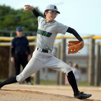 Kubasaki's Nick Adams kicks and delivers against Kadena during Monday's DODEA-Okinawa baseball game. The Dragons won 8-3.