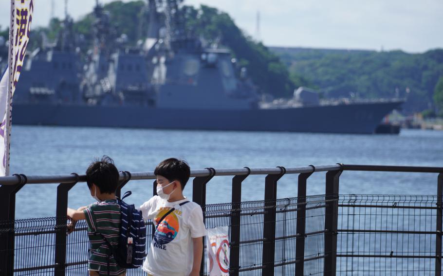 Kids wear masks while playing in a park near Yokosuka Naval Base, Japan, Thursday, June 2, 2022. 