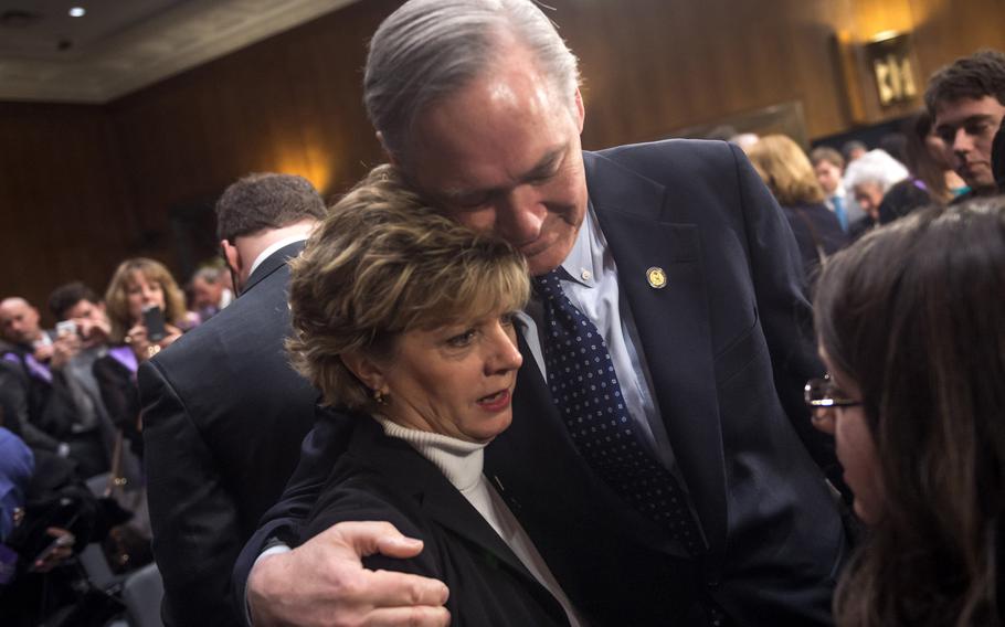 Former Rep. Dennis Moore (D-Kan.), who retired from the House of Representatives after being diagnosed with Alzheimer’s, hugs his wife, Stephene, after he testified at a hearing on “The Rising Cost of Alzheimer’s” on Capitol Hill on Wednesday, Feb. 26, 2014, in Washington, D.C. Moore died Tuesday at age 75.