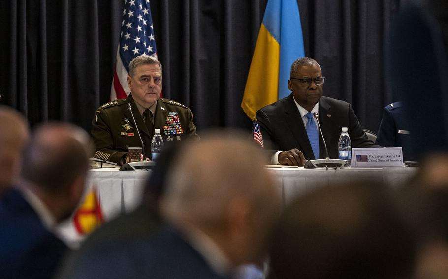 Defense Secretary Lloyd Austin, right, and Army Gen. Mark Milley, chairman of the Joint Chiefs of Staff, left, meet with leaders from across the world to discuss the ongoing crisis in Ukraine during the Ukraine Defense Consultative Group at Ramstein Air Base, Germany, April 26, 2022. 