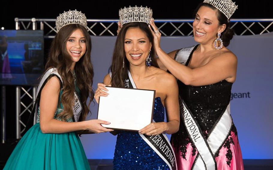 Air Force Maj. Raliene Banks, center, won her third title, Mrs. Regency International, in Las Vegas on July 31, 2021. 