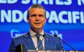 Hegseth at the microphone.