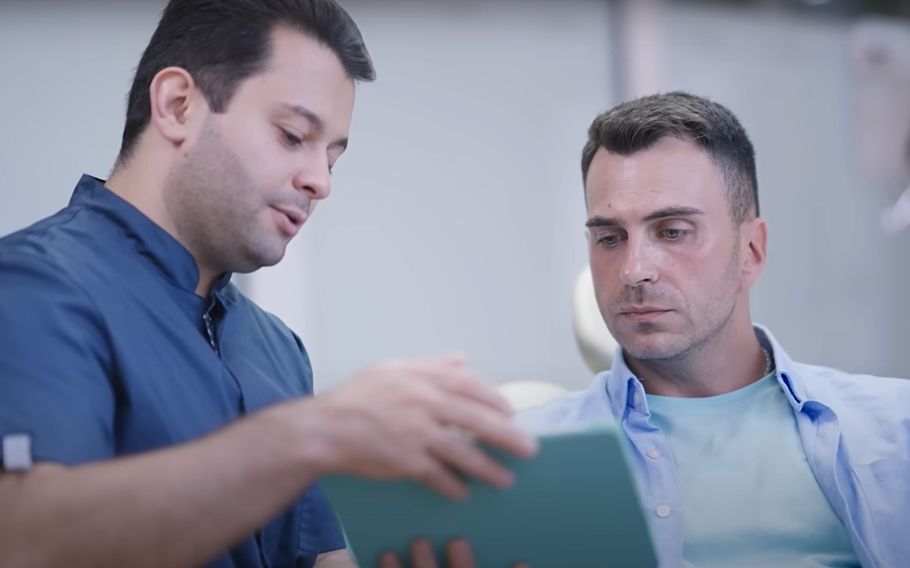 Two men looking at a document together